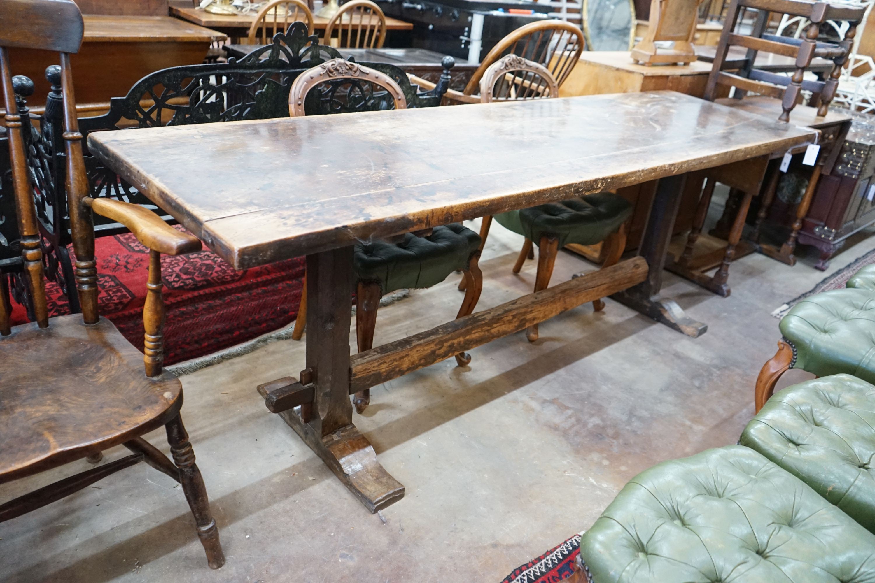 A rectangular oak refectory dining table, length 228cm, depth 64cm, height 78cm